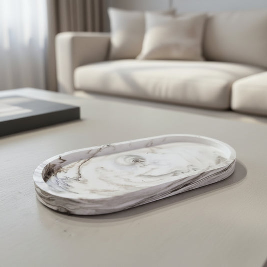 Marble-patterned tray on a coffee table with a blurred sofa in the background