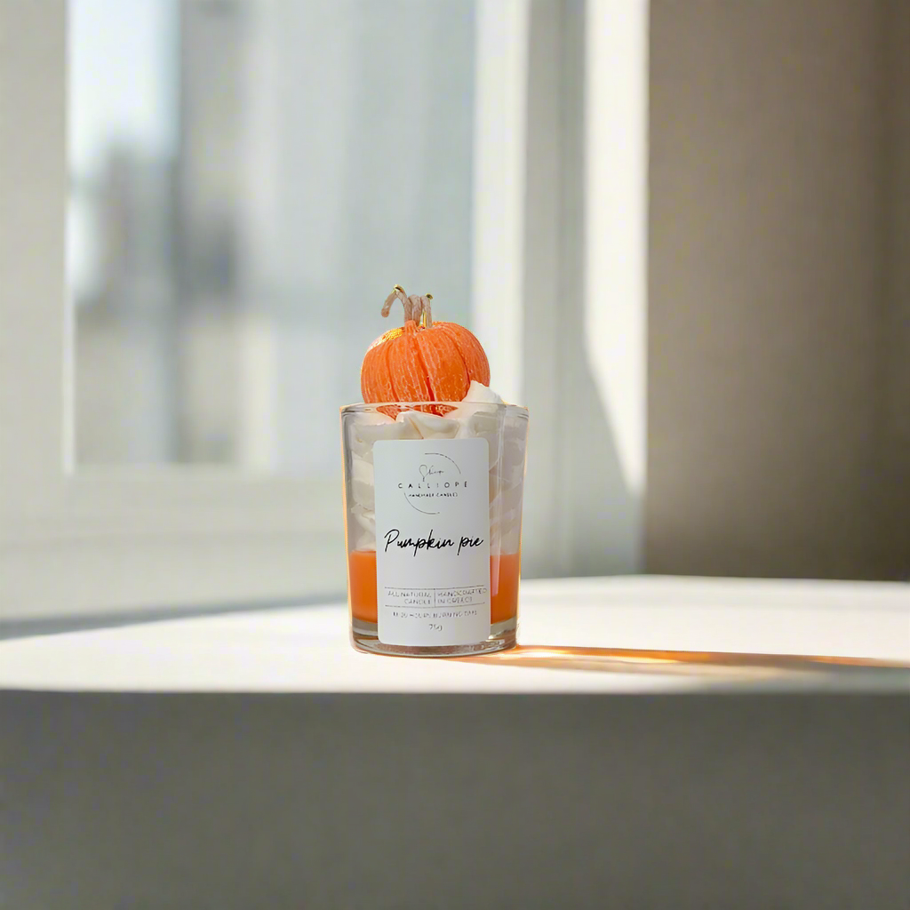 Candle shot with pumpkin decoration on a windowsill
