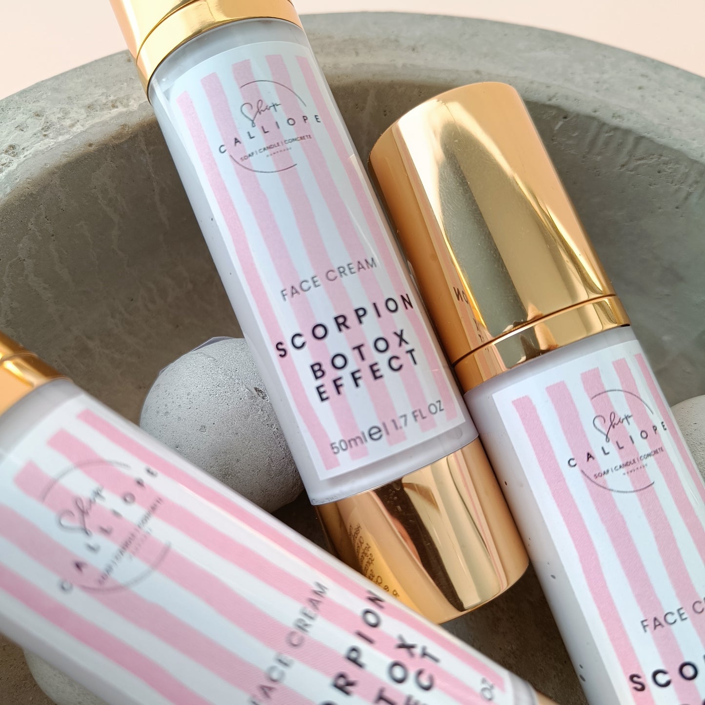 A pump bottle of Scorpion Botox Effect face cream with a gold cap, labeled for anti-wrinkle and moisturizing benefits.