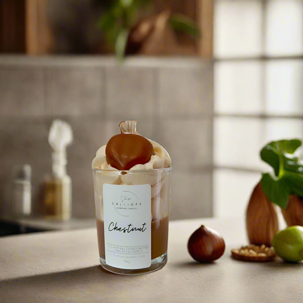 Candle shot labeled 'Chestnut' on a kitchen counter with chestnuts and a plant in the background.