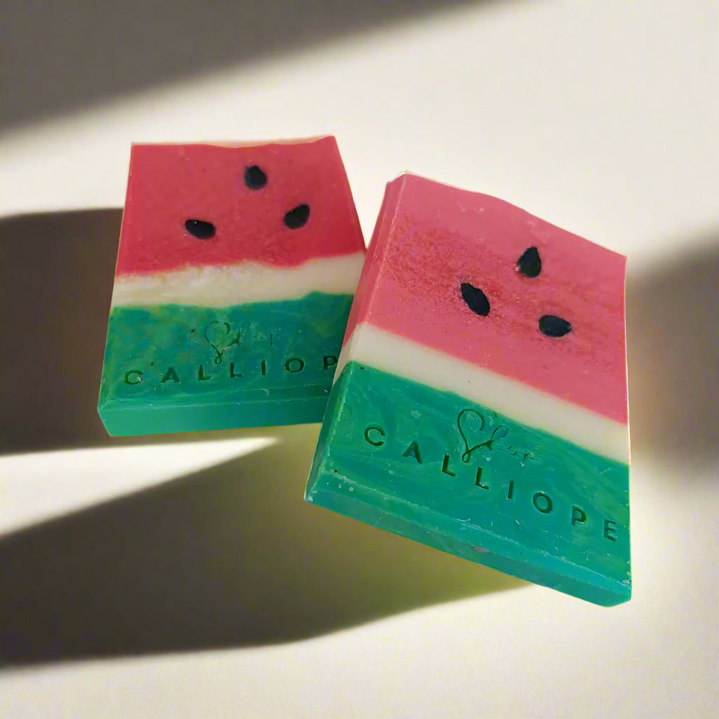 Two watermelon-themed soap bars with 'Calliope' branding on a light background