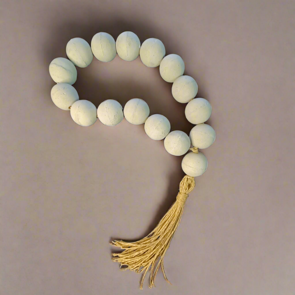 Greek komboloi with gray concrete beads and a utah tassel on a white background