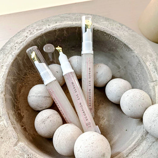 eye serum tubes in concrete bowl with concrete beads