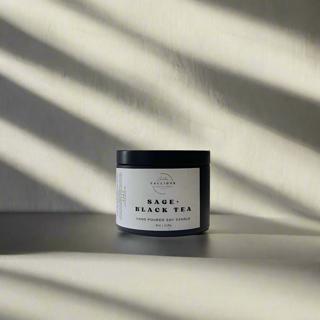 candle in black tin