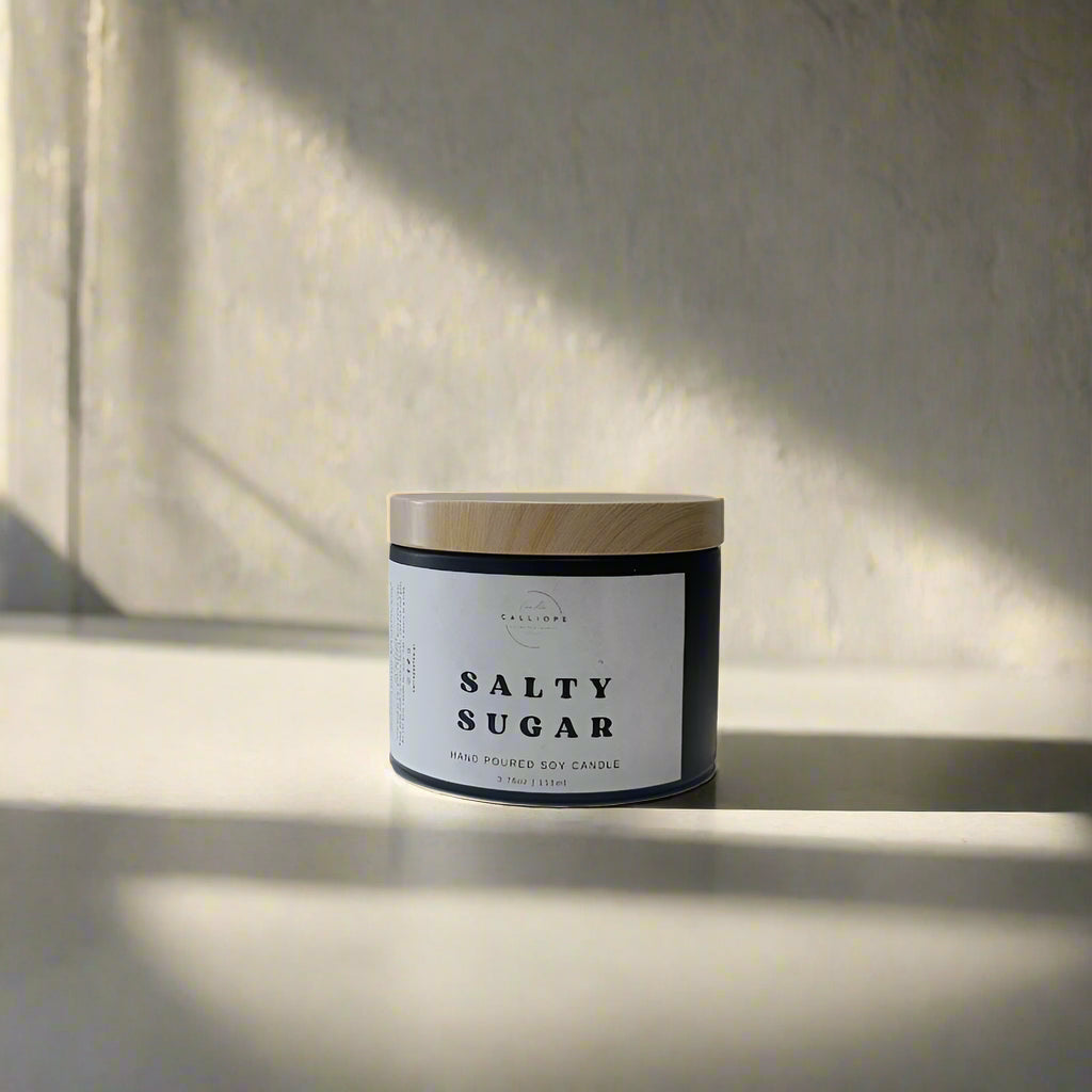 Candle jar labeled 'Salty Sugar' on a white background