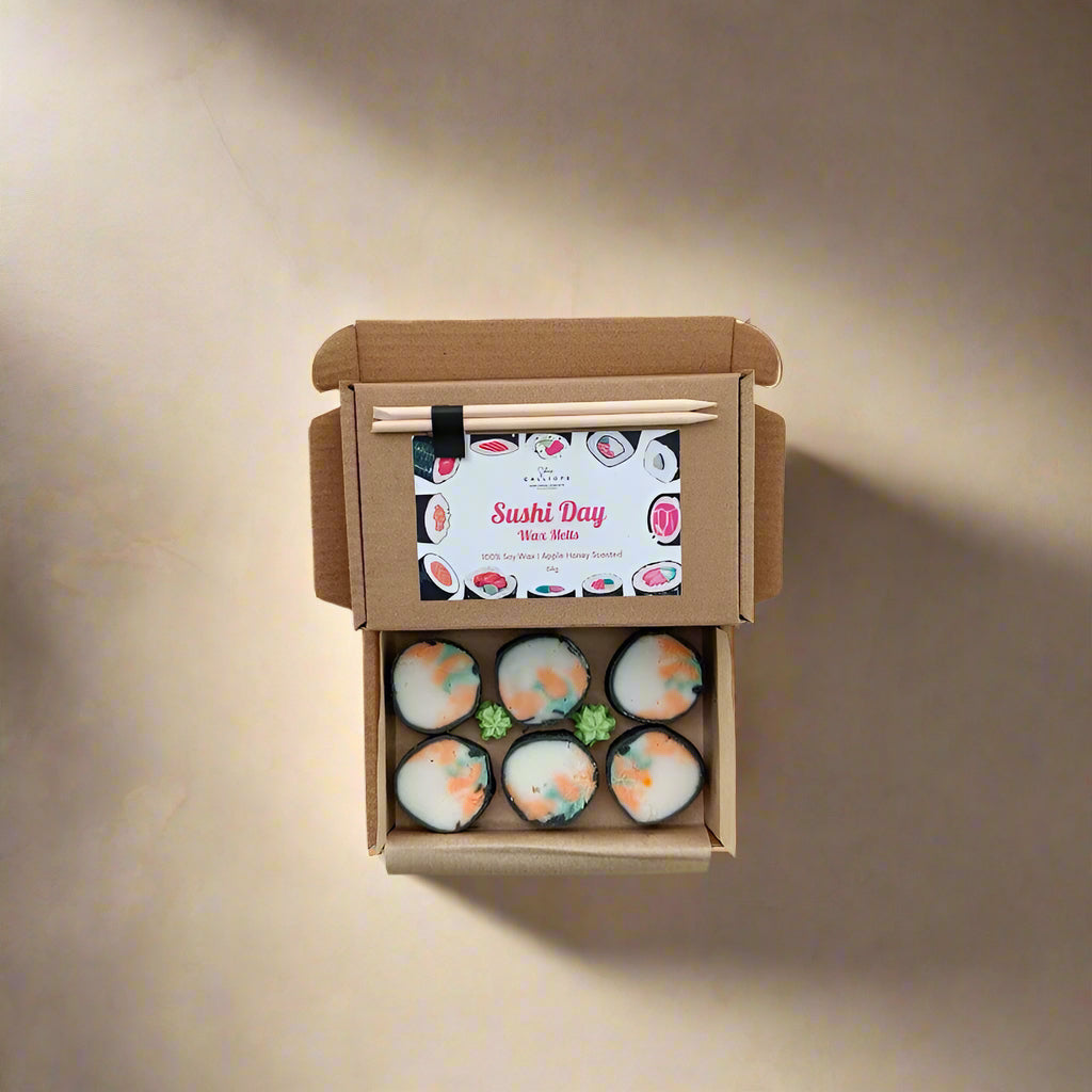 Box of sushi with a decorative label on a neutral background