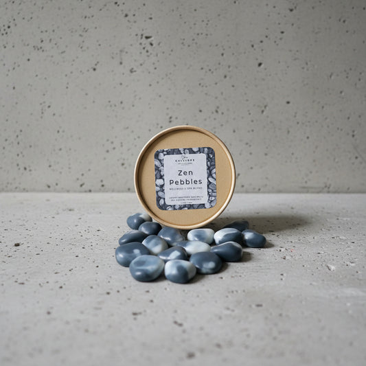 Zen pebbles Wax Melts with a container labeled 'Zen Pebbles' on a light gray surface.
