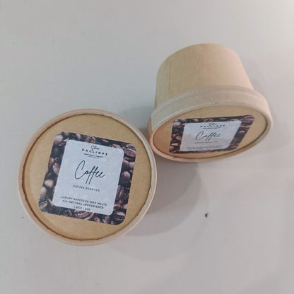 Two  craft boxes of coffee-scented wax melts on a white background