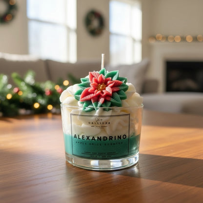 Decorative candle with floral design on top, placed on a wooden surface with a festive background.