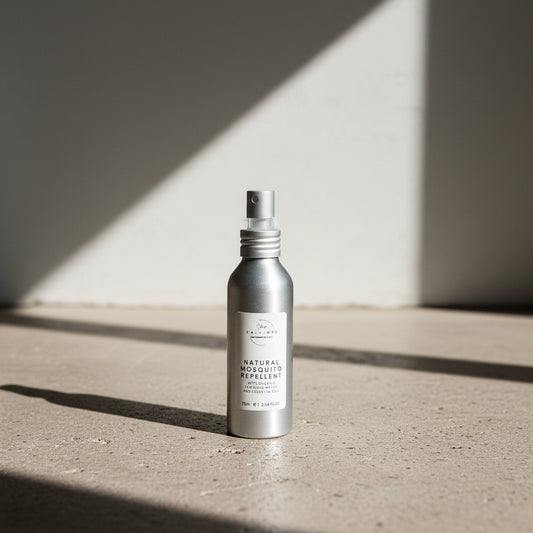 Bottle of natural mosquito repellent on a surface with a dark background