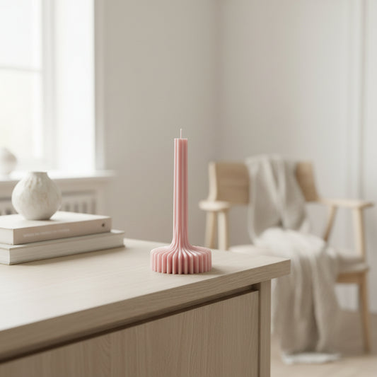 Pink hairbrush on a white surface with a pink bag in the background