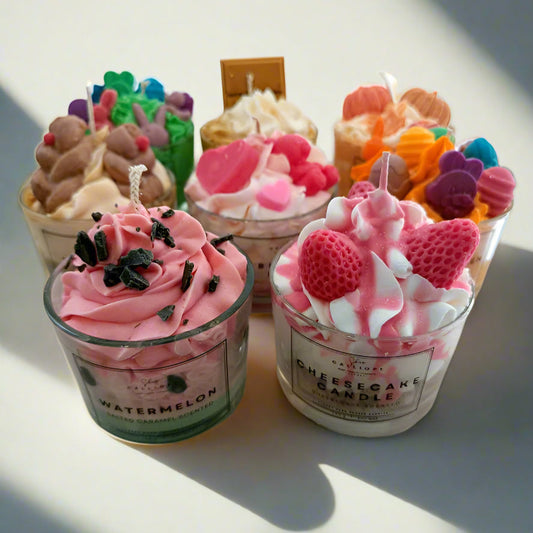 Decorative candles shaped like ice cream cups on a light surface