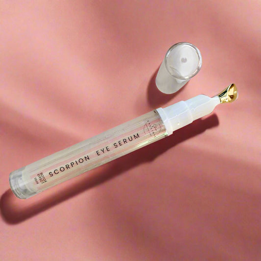 eye serum tube on pink background