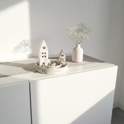 Decorative items on a white surface with a neutral background
