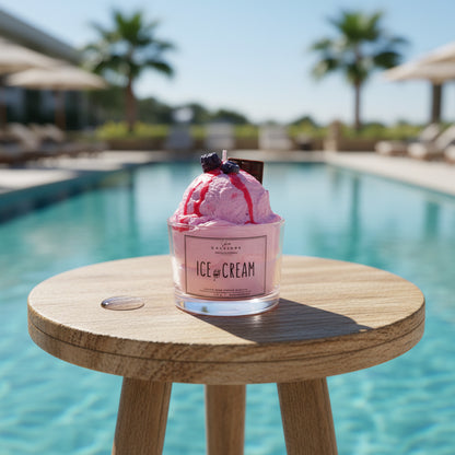 Pink ice cream candle with a label on a countertop