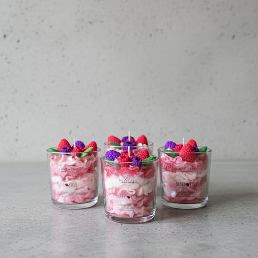 Candles in a glass jar with decorative elements on top, labeled 'Berry Rush'.