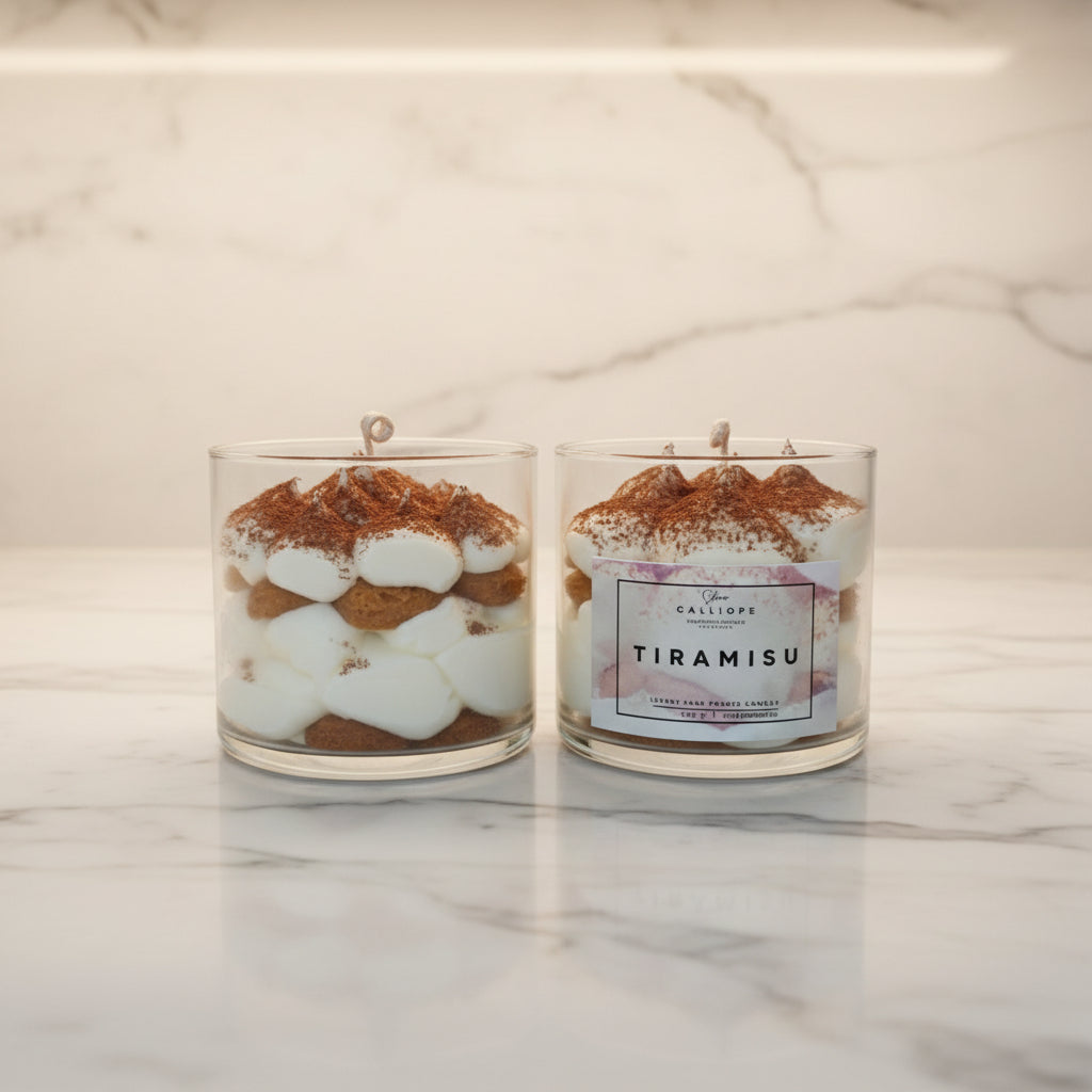 Two tiramisu-themed candles on a wooden surface with a neutral background
