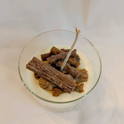 Glass container with dog treats on a white background