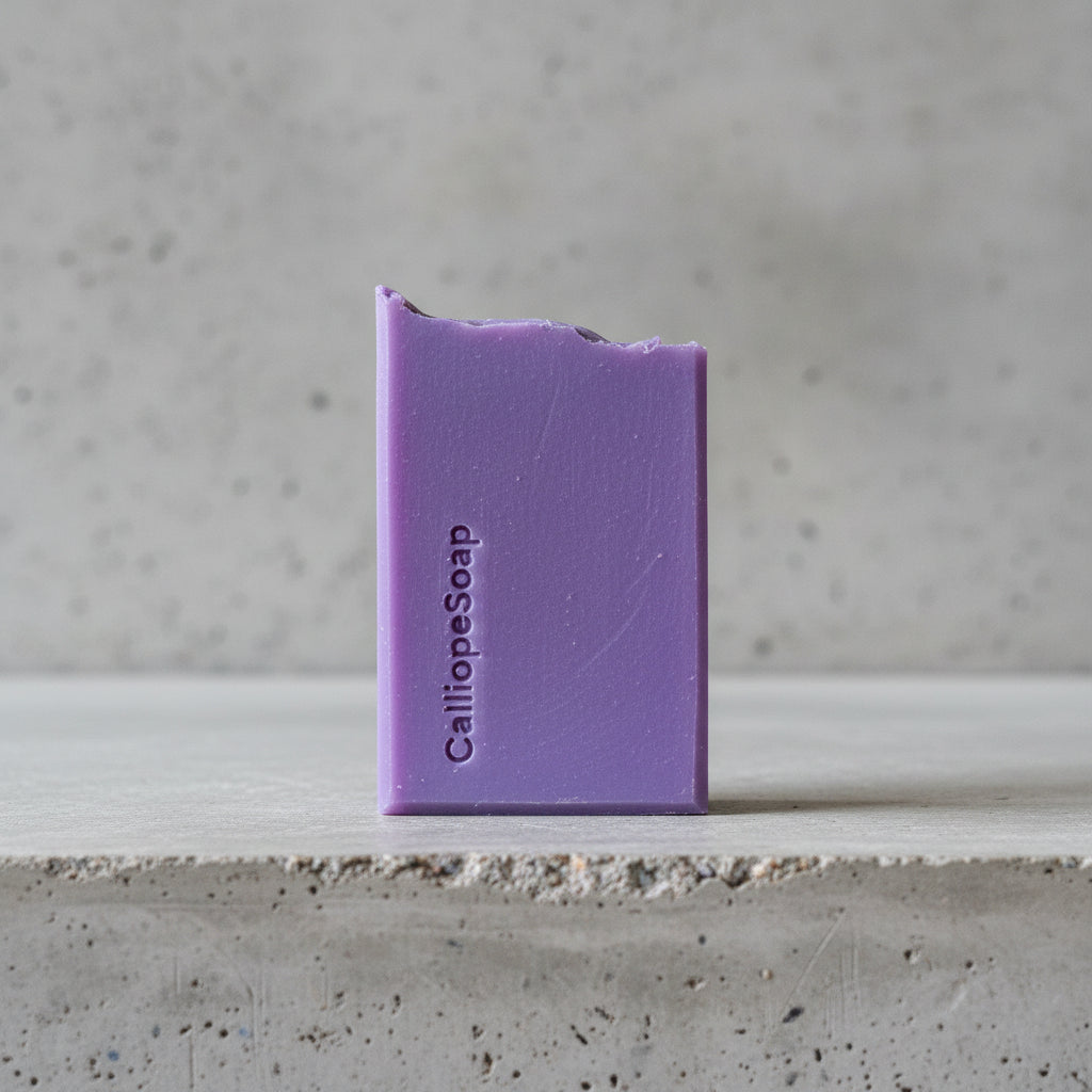 Purple bar of soap with 'CalliopeSoap' branding on a light surface.