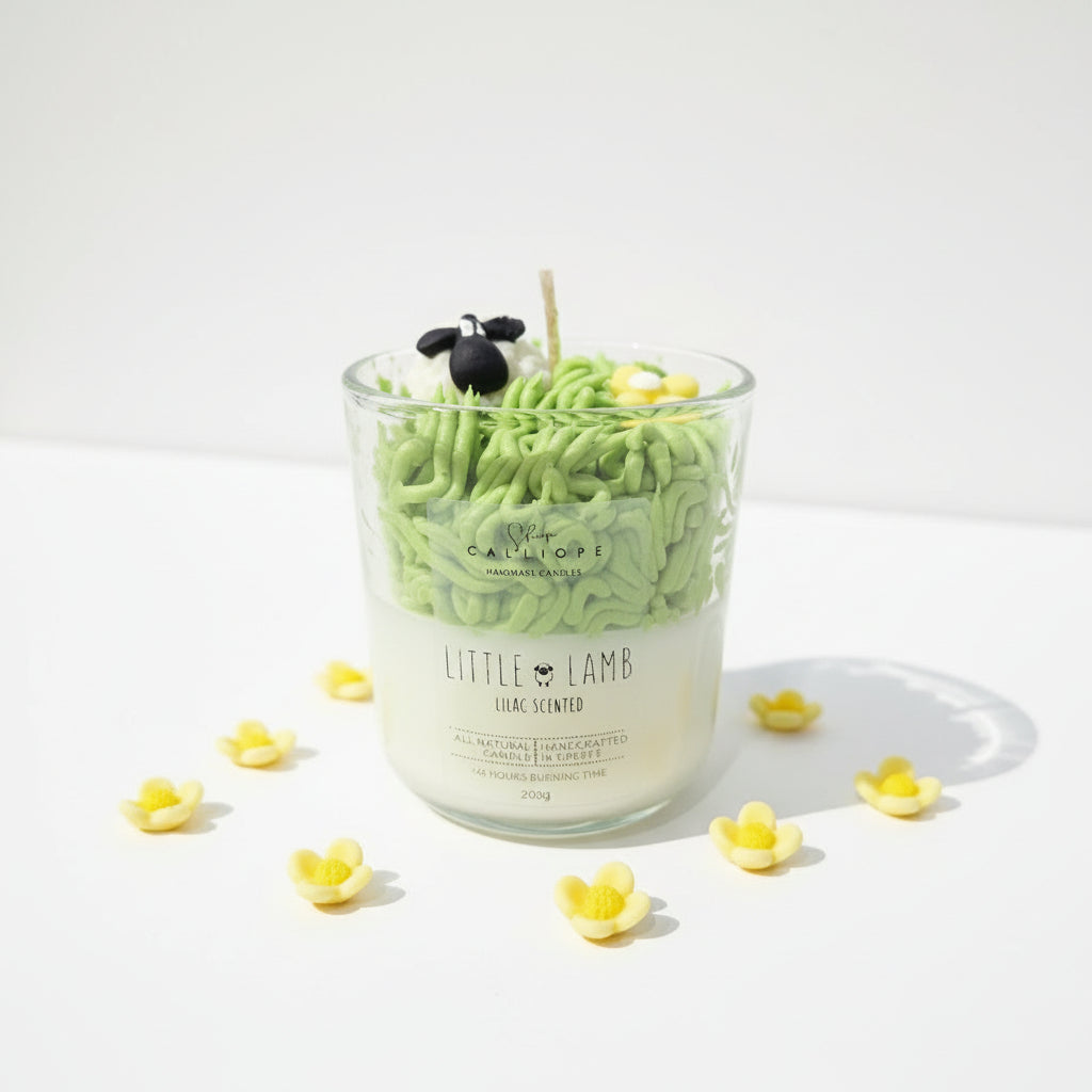Green candle shaped like a lamb with 'Calliope' branding on a white surface.