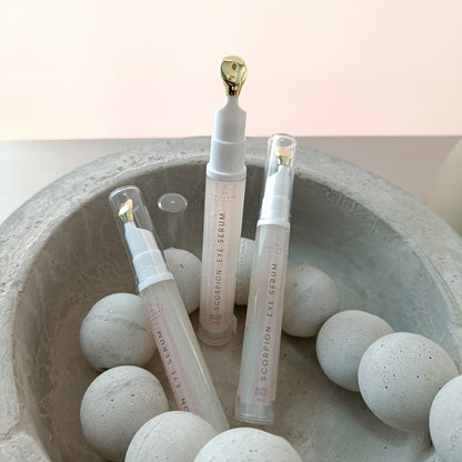 eye serum tubes in concrete bowl with concrete beads