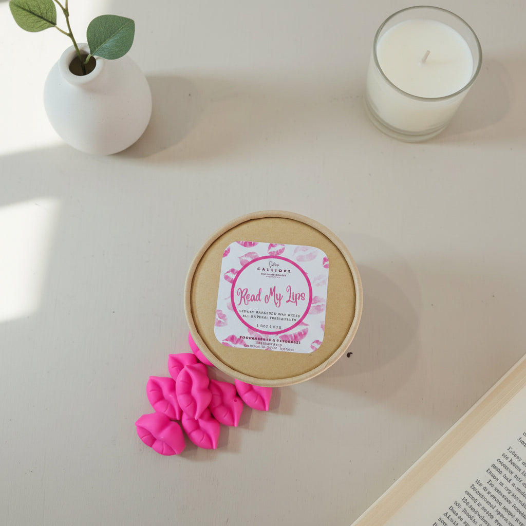 Pink lip shaped wax melts with a round container on a light gray background 