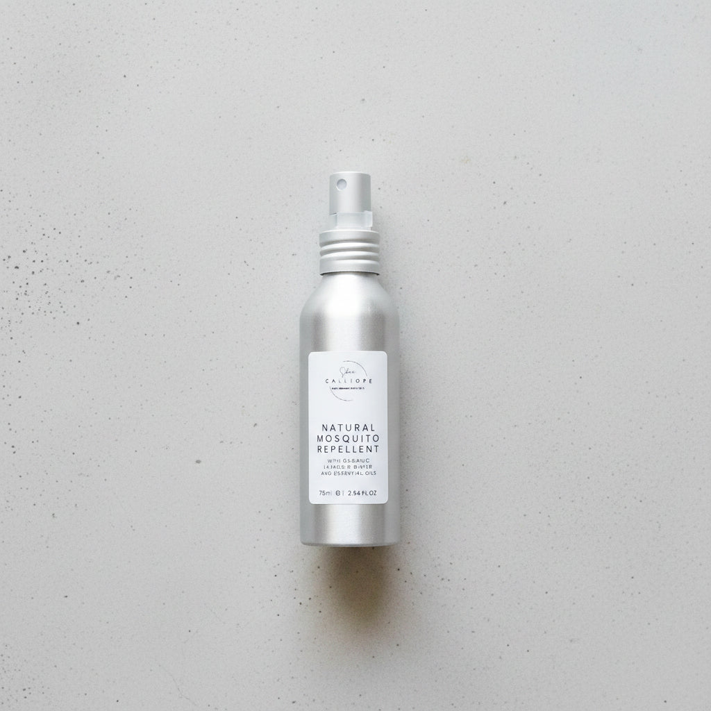 Silver spray bottle labeled 'Natural Mosquito Repellent' on a wooden surface.