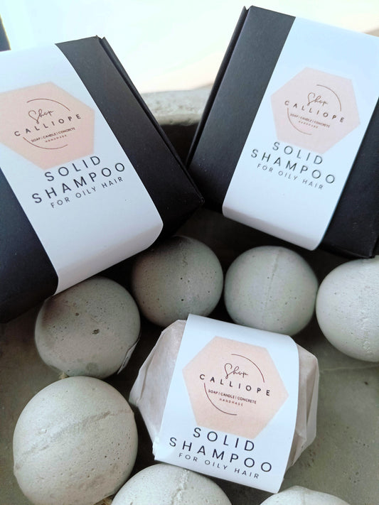 Solid shampoo bars packaged and labeled as solid shampoo for oily hair