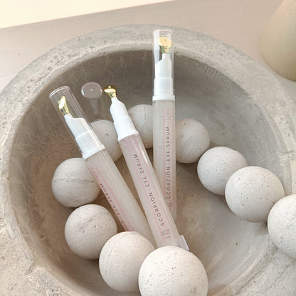 eye serum tubes in concrete bowl with concrete beads
