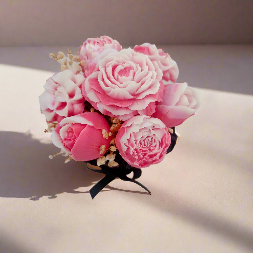 Bouquet of pink and white flowers on a light gray background