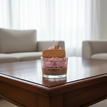 Cookies in Pink Candle with a cookie on top on a light surface.
