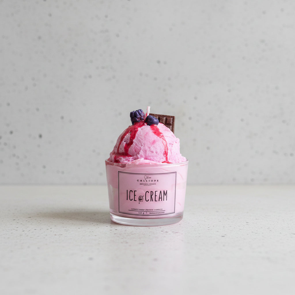 Pink ice cream with toppings in a container labeled 'Ice Cream' on a table.