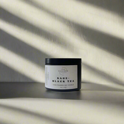 candle in black tin