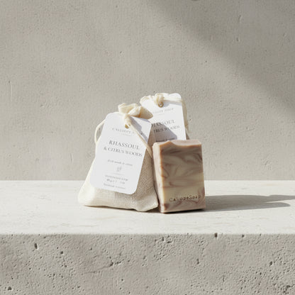 Handmade soap with a label on a gray surface
