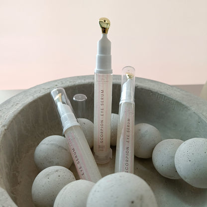 eye serum tubes in concrete bowl with concrete beads