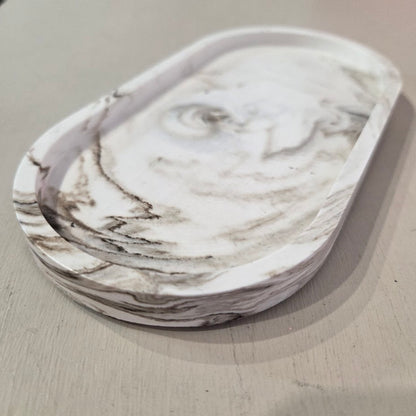 Marble-patterned dish on a light gray surface