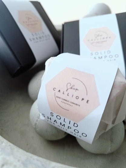 Solid shampoo bars packaged and labeled as solid shampoo for oily hair