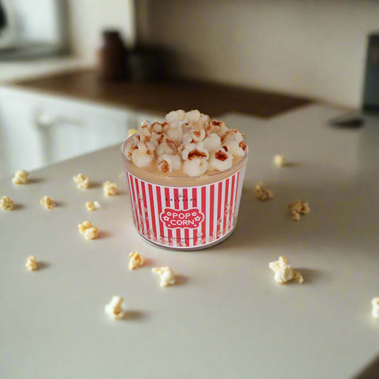 Popcorn in a red and white striped cup on a kitchen counter with 'Opopo Corn' branding.