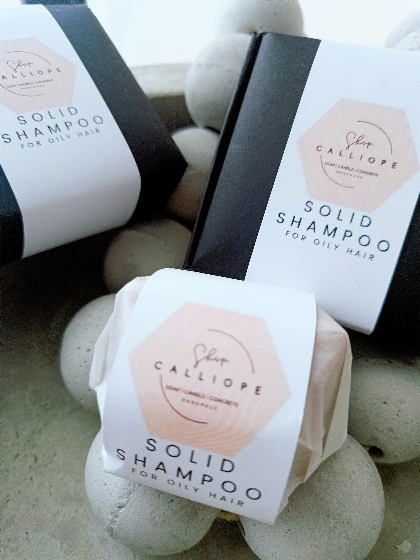 Solid shampoo bars packaged and labeled as solid shampoo for oily hair