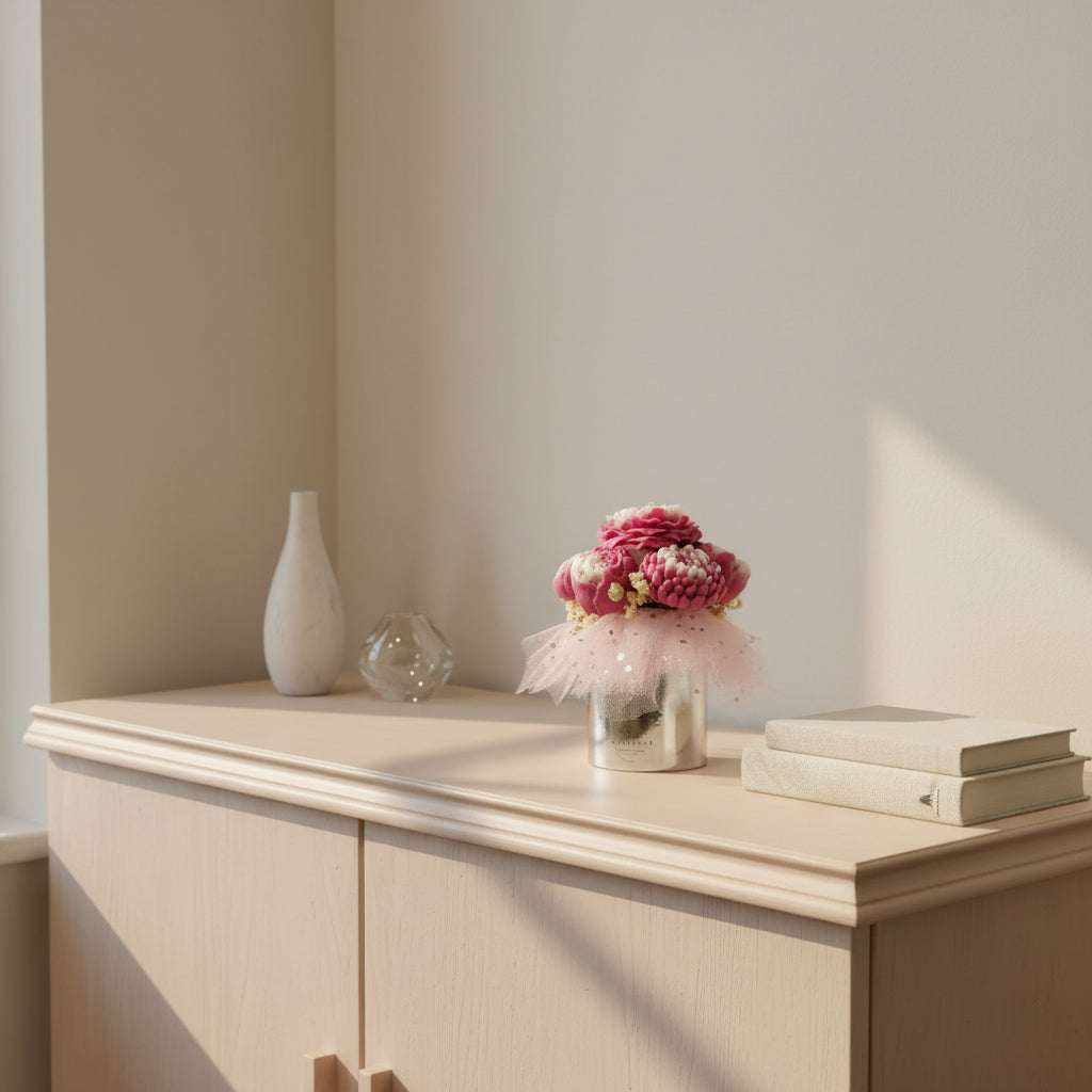 Decorative items on a wooden surface with a neutral background