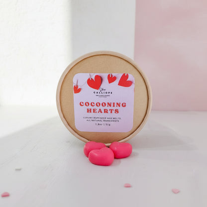 Cocooning Hearts wax melts with a round container on a white background