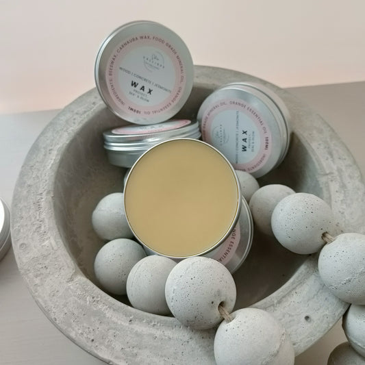 wax sealer tin container on concrete bowl with concrete beads