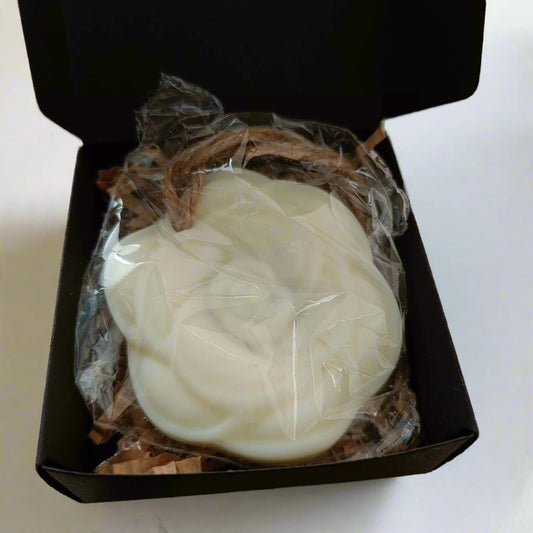 white wax tart flower shaped in black box