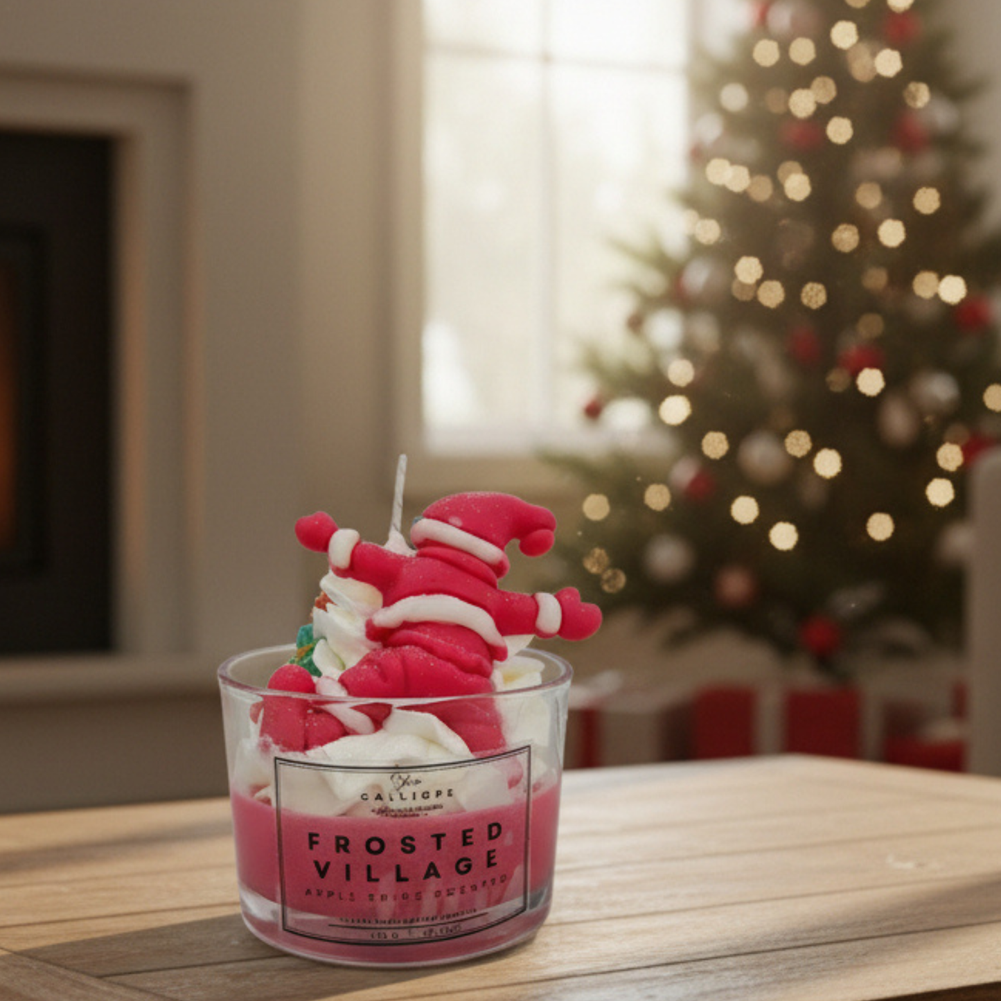 Frosted Village candle in a glass jar with a Christmas tree in the background