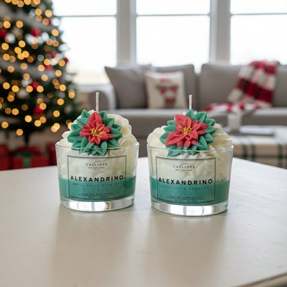 Two Alexandrino candles with floral designs on a table in a festive living room.